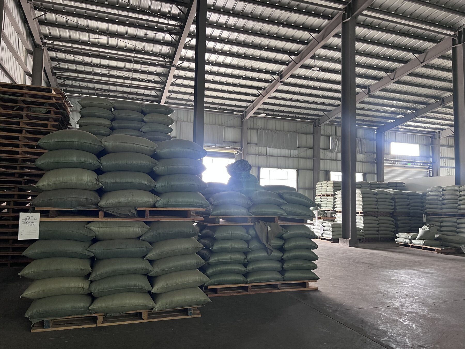Palletised coffee in a clean warehouse